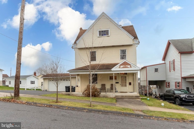 view of front of house with a porch and a garage