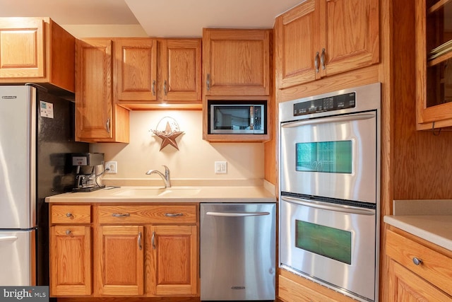 kitchen featuring stainless steel appliances and sink