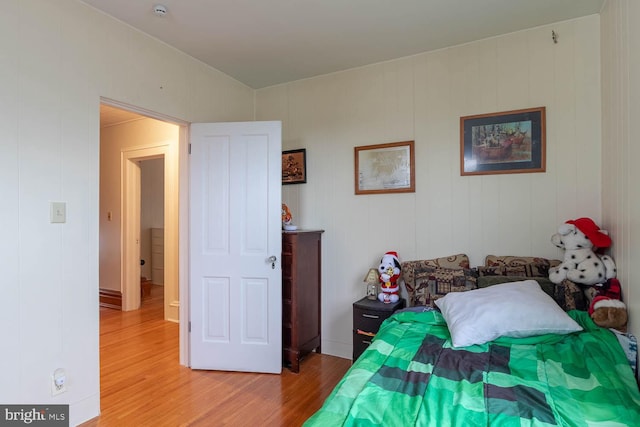 bedroom with hardwood / wood-style flooring