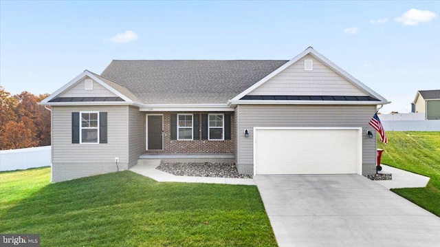 view of front of home featuring a garage and a front lawn