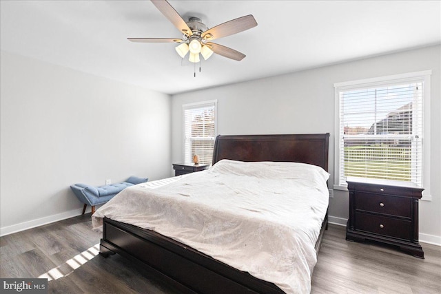 bedroom featuring dark wood-type flooring and ceiling fan