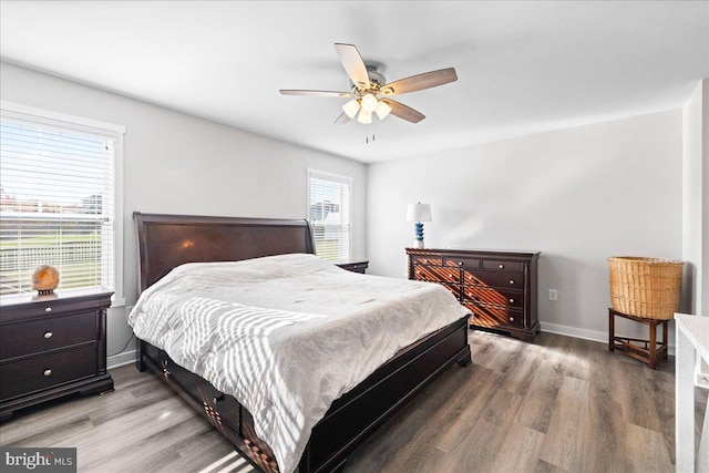 bedroom with hardwood / wood-style flooring and ceiling fan