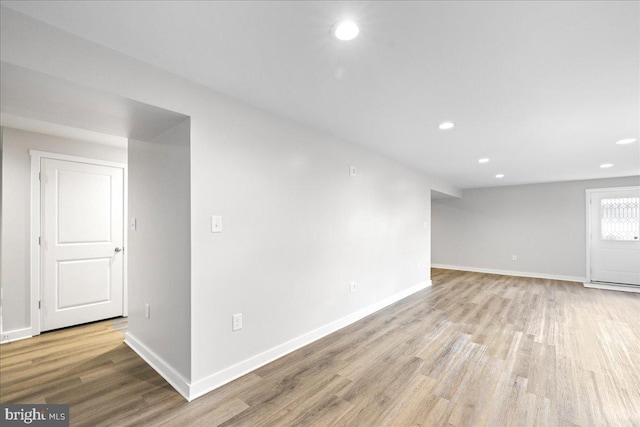 spare room with light wood-type flooring