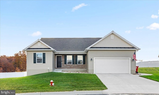 view of front of house featuring a garage and a front lawn