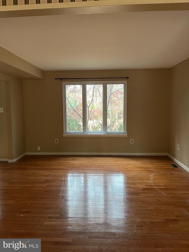 spare room with light wood-type flooring