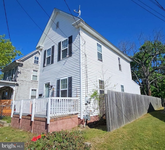 view of property exterior with a yard