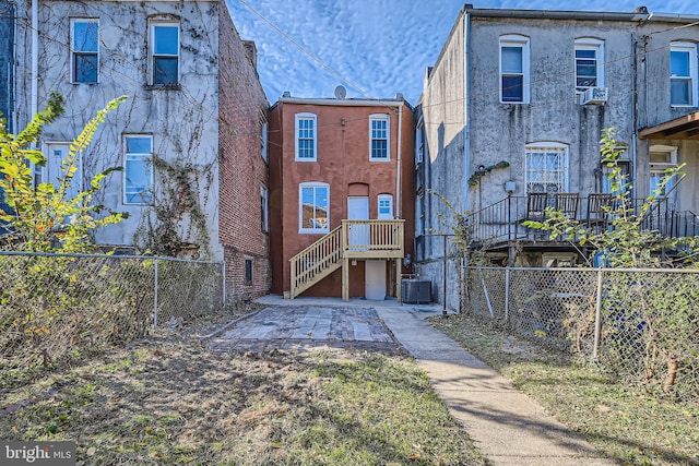 back of property featuring central air condition unit