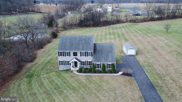 birds eye view of property featuring a rural view