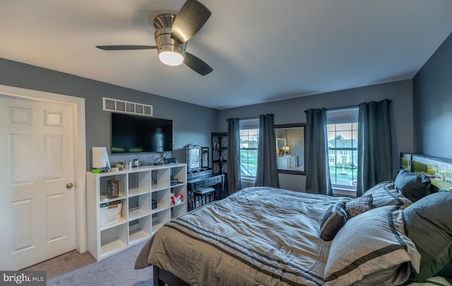 carpeted bedroom featuring ceiling fan