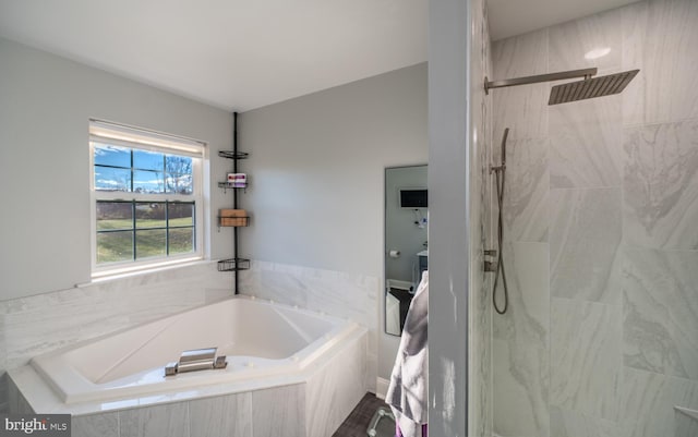 bathroom with separate shower and tub