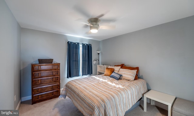 bedroom with light colored carpet and ceiling fan