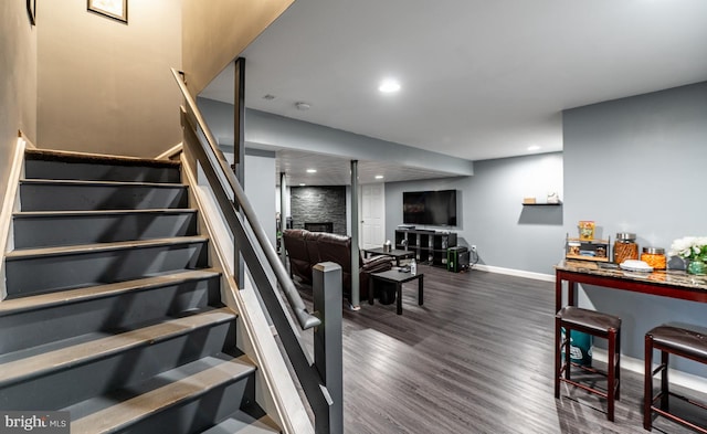 staircase with hardwood / wood-style floors