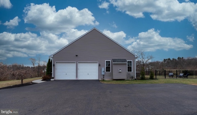 view of side of home with a garage