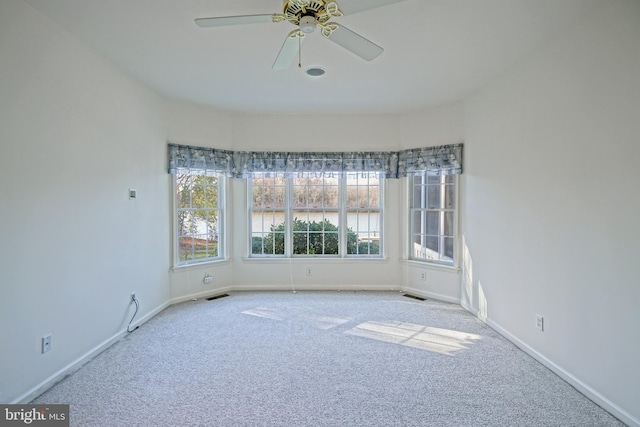 carpeted empty room with ceiling fan