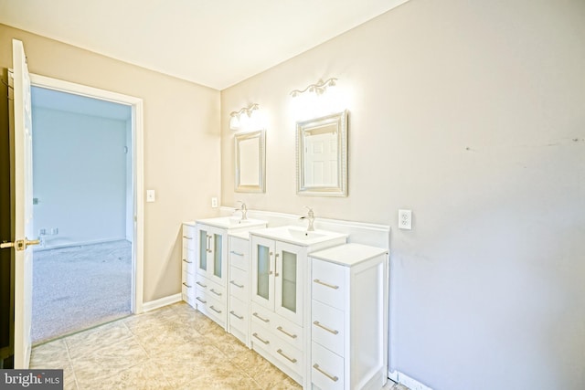 bathroom featuring tile patterned flooring and vanity