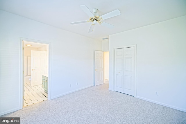 unfurnished room featuring ceiling fan and light carpet