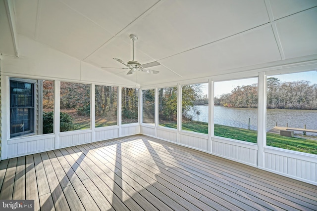 unfurnished sunroom with a water view and ceiling fan