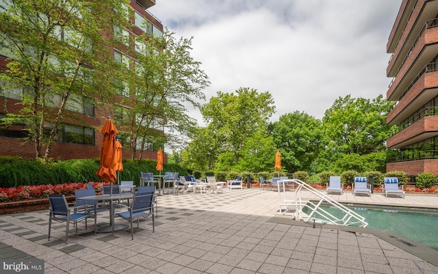 view of patio with a community pool