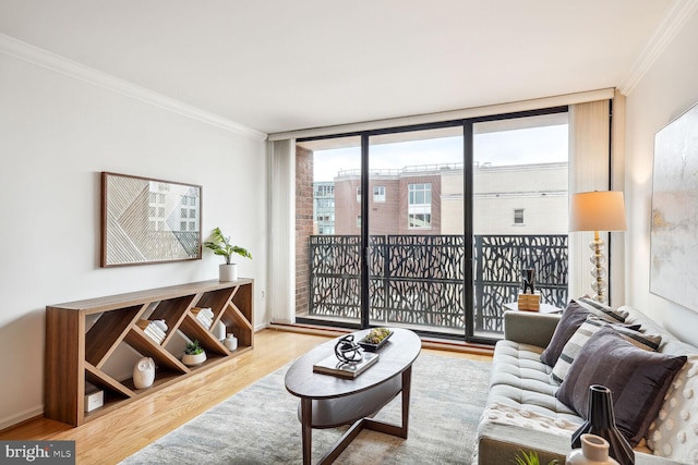 living room featuring a wall of windows, wood-type flooring, and crown molding