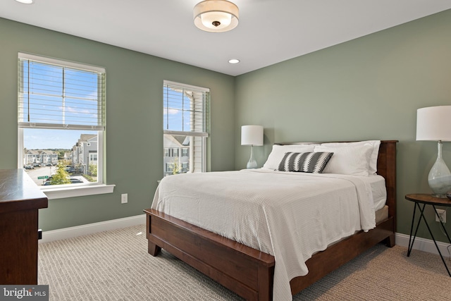 bedroom featuring light colored carpet