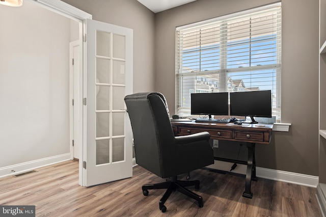 office area with light wood-type flooring