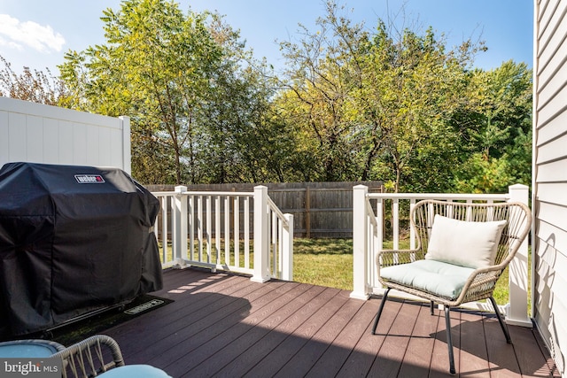 wooden deck with a grill