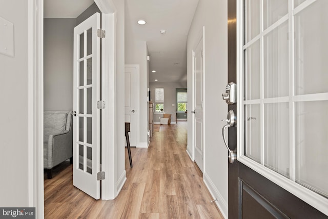 corridor featuring light wood-type flooring