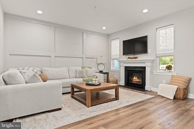 living room with light hardwood / wood-style flooring