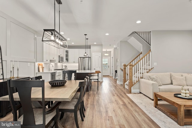 dining space with light hardwood / wood-style floors