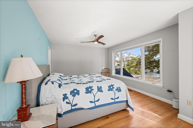 bedroom featuring ceiling fan and wood-type flooring