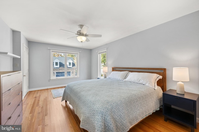 bedroom featuring ceiling fan and light hardwood / wood-style floors