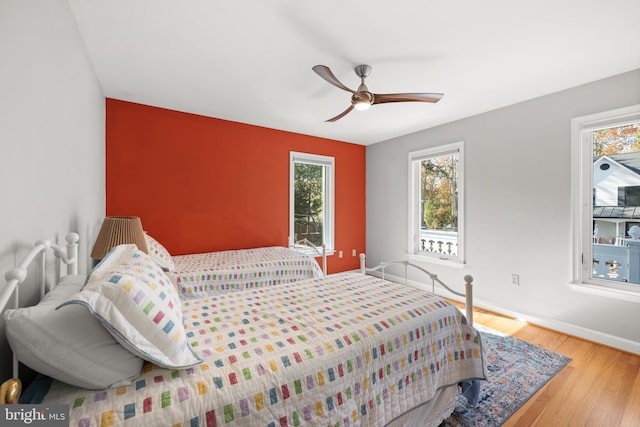 bedroom featuring hardwood / wood-style floors and ceiling fan