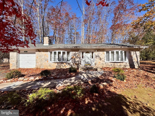 ranch-style home featuring a garage