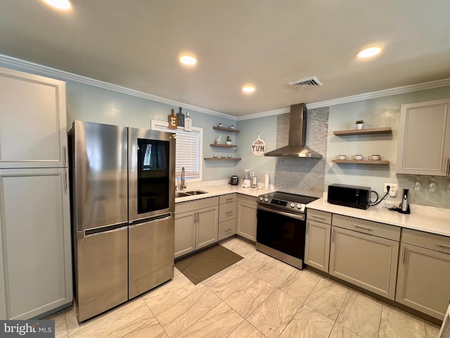 kitchen featuring stainless steel appliances, wall chimney range hood, sink, and tasteful backsplash