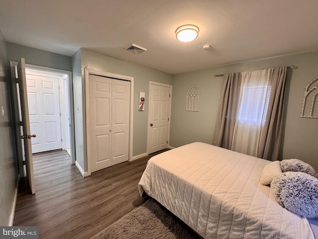 bedroom featuring dark hardwood / wood-style floors