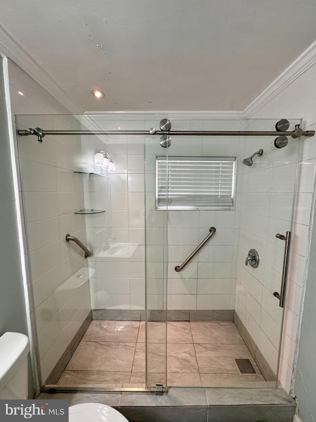 bathroom featuring walk in shower, toilet, and crown molding