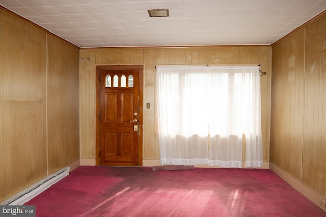 entrance foyer featuring carpet flooring, wooden walls, and a baseboard radiator