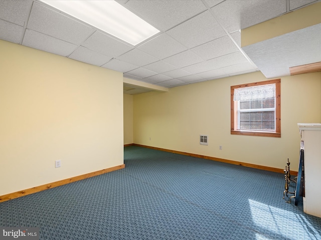 basement featuring a drop ceiling