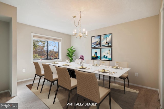 dining area with light carpet and a chandelier