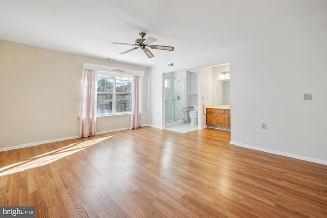 spare room featuring light wood-type flooring and ceiling fan