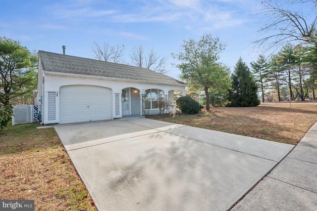 view of front of house featuring a porch, a garage, and a front yard