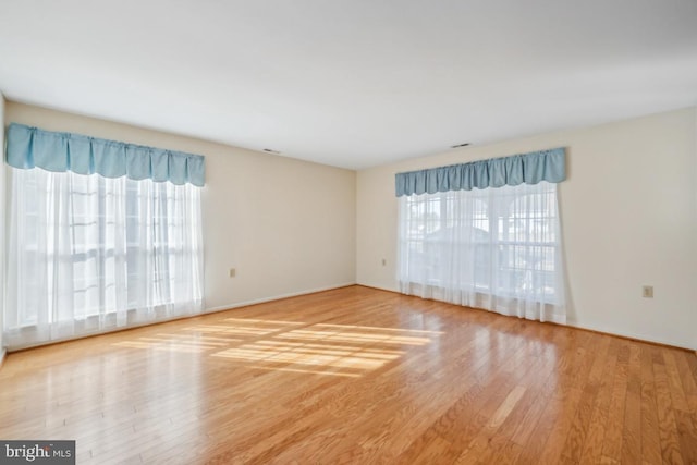 empty room featuring wood-type flooring