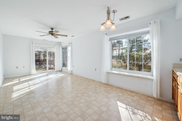 interior space featuring ceiling fan