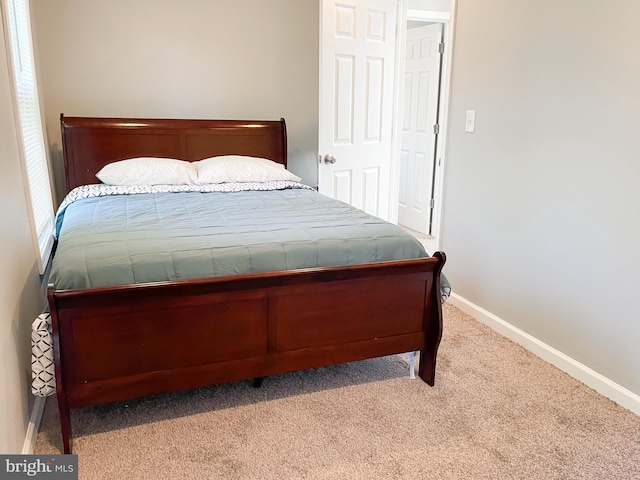 bedroom with light colored carpet