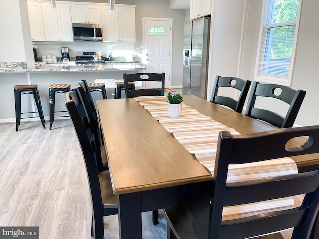 dining room featuring light wood-type flooring