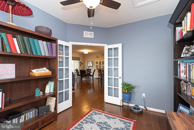 home office featuring ceiling fan, french doors, and dark hardwood / wood-style floors