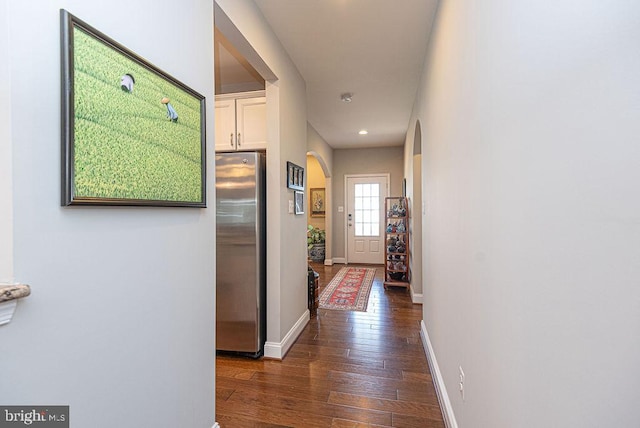 corridor featuring dark hardwood / wood-style flooring