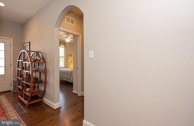 hallway featuring dark hardwood / wood-style flooring