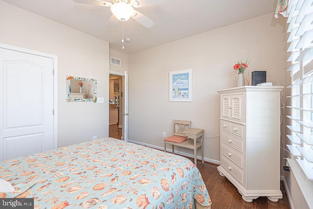 bedroom featuring ceiling fan and dark wood-type flooring