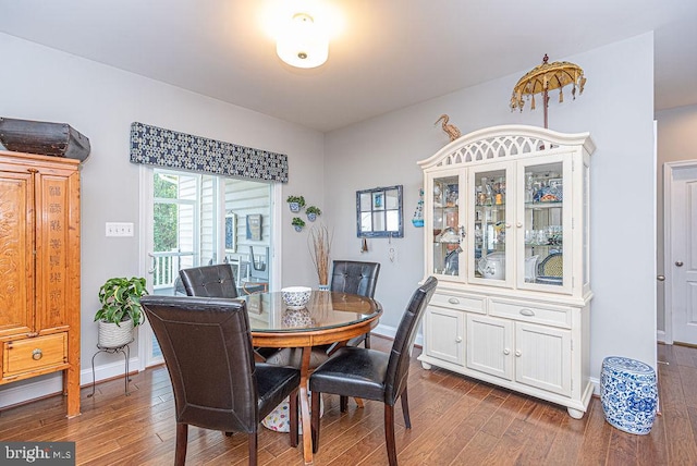 dining space featuring dark hardwood / wood-style floors